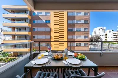 a kitchen with a sink and a counter top at Exclusive Apartment in Quarteira Walk to Beach in Quarteira