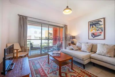 a living room with a couch and a table at Galé by the Sea in Guia