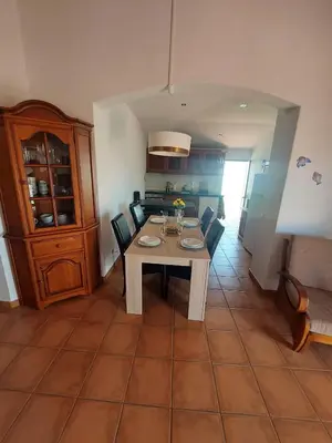 a dining room with a table and chairs in a room at Jacaranda 43-Moradia terrea in Albufeira