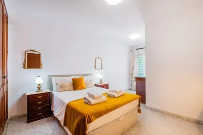 a bedroom with a bed with towels on it at Apartment Solera in Albufeira