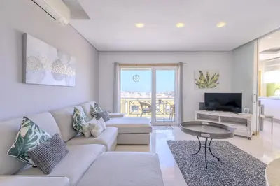 a living room with a couch and a table at #340 Old Town Garden Hill Z by Home Holidays in Albufeira