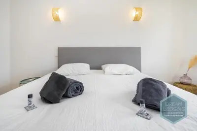 a bedroom with a bed with towels on it at Quinta do Pinheiro Residence AF - Dream Lodging in Albufeira