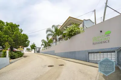 an empty street in front of a building at Quinta do Pinheiro Residence AF - Dream Lodging in Albufeira