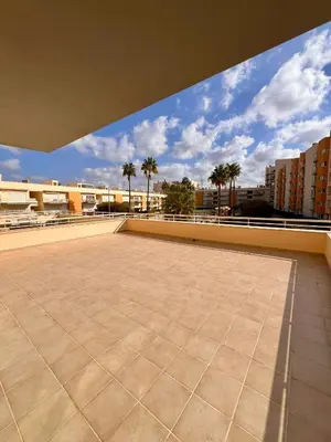 a view from the roof of a building with palm trees at Vilamoura apartment in Quarteira