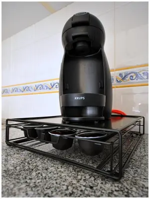 a coffee maker sitting on top of a counter at Apartamentos Capitolina in Quarteira