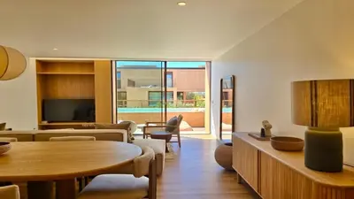 a living room with a table and a couch at Casa Centavo - Natura Village, CD 317 - Cleverdetails in Quarteira