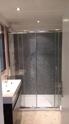 a bathroom with a shower and a sink and a showerspective at Bay View Apartments in Albufeira