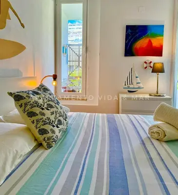 a bedroom with a bed with a pillow and a window at Apartamento Vida & Mar at Albufeira Beach in Albufeira