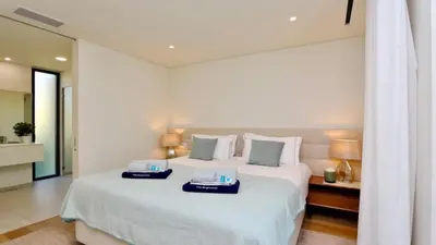 a bedroom with a large bed with two trays on it at Casa Bougainvillea by CleverDetails, private pool 