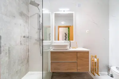 a bathroom with a sink and a shower at Falésia Beach I by HelloVacations in Albufeira