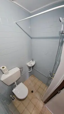 a bathroom with a toilet and a sink at Blife Olindya private rooms in Faro