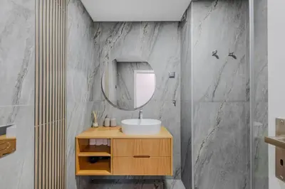a bathroom with a sink and a mirror at Alexandra Paradise in Albufeira