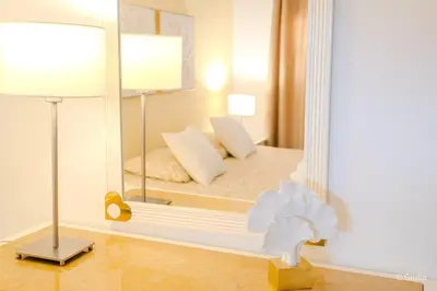 a bedroom with a mirror with a bed in it at Algarve Vilamoura Quarteira vue sur Ocean-Portugal in Quarteira