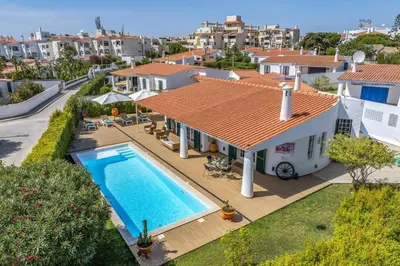 an aerial view of a house with a swimming pool at Villa Medicis by Villa Plus in Albufeira