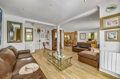 a living room with a couch and a table at Villa Medicis by Villa Plus in Albufeira