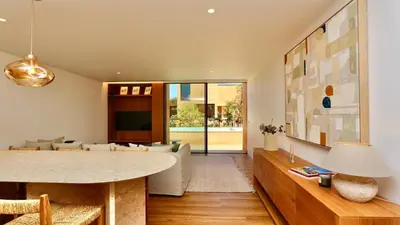 a living room with a table and a couch at Villa Harmony - Natura Village by Cleverdetails in Quarteira