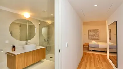 a bathroom with a sink and a shower and a bed at Villa Harmony - Natura Village by Cleverdetails in Quarteira