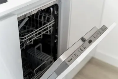 a microwave oven with its door open with a dishwasher at Downtown, 1br with a first row view over the sea in Faro