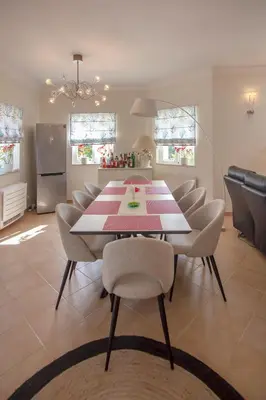 a dining room with a table and chairs at Amazing villa in Albufeira - Alke Vida in Albufeira