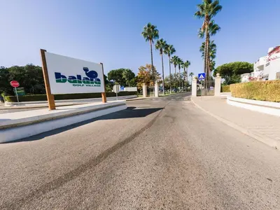 an empty street with a sign on the side of the road at Apartment with 2 bedrooms in Balaia, Olhos de Água, Albufeira in Albufeira