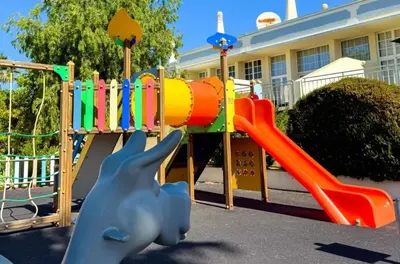 a playground in front of a building at Villa 23 - Ponta Grande Resort in Albufeira