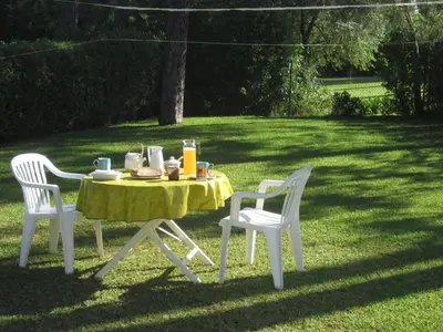 a table and two chairs with a table and a table and chairs at Your villa in Vilamoura in Quarteira