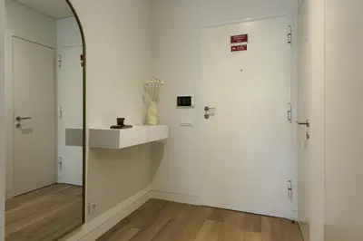 a bathroom with white walls and a mirror at Vilamoura Parque - Luxury Villa with pool by HD in Vilamoura
