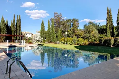 a swimming pool in a yard with trees at Casa do Sol and Golf - Vilamoura in Vilamoura