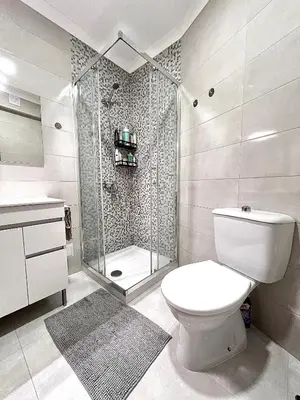a bathroom with a toilet and a shower at OMG Faro in Faro
