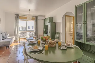 a dining room with a table with food on it at #348 Apartment Madaleno by Home Holidays in Roja- Pé