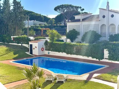 a swimming pool in the yard of a house at Vilamoura Brightness Apartment with Pool by Homing in Vilamoura