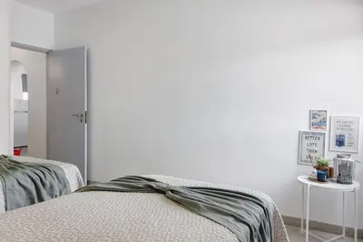 a bedroom with two beds with a bow on it at Casa Machadinho in Albufeira