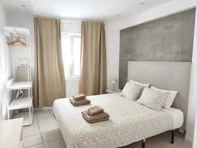 a bedroom with a bed with two towels on it at Studio 39 Downtown in Faro