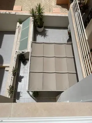 an overhead view of a building with potted plants at City Dreams in Faro