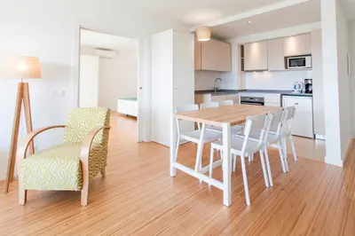 a kitchen and dining room with a table and chairs at Alfagar Prestige in Albufeira
