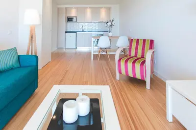 a living room with a couch and a table at Alfagar Prestige in Albufeira