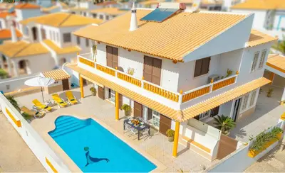 an aerial view of a house with a swimming pool at Villa Mare in Albufeira