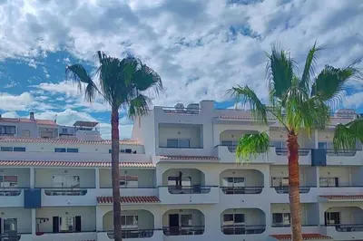 a bathroom with a shower curtain with dolphins on it at Apartment - Sleeps 2 - Pool - Parking - Balcony in Albufeira