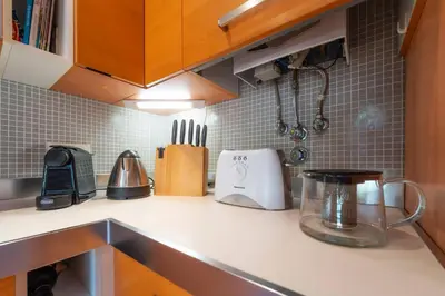 a kitchen counter with utensils and a blender on it at 3 Quartos, Piscina, AC, Garagem, Prestige For Home in Faro