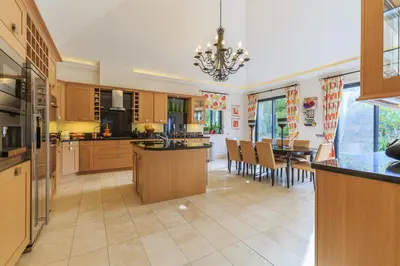 a large kitchen and dining room with a dining table at Villa Flow