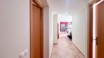 a hallway with a door leading to a room at Ocean View Quarteira in Quarteira