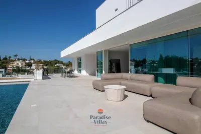 a house with a swimming pool at night at Modern 4-Bedroom Villa with Infinity Pool in Albufeira