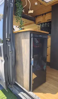 an inside of an rv with a door open at Tiny House na Praia de Faro Experiencia Glamping in Faro