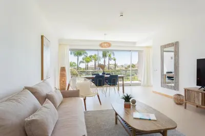 a living room with a couch and a table at Snazzy Varandas do Castelo One Bedroom Apartment sleeps 2 persons in Albufeira