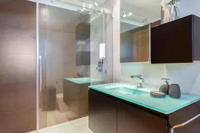 a bathroom with a glass shower and a sink at Snazzy Varandas do Castelo - One Bedroom Apartment sleeps 2 person in Albufeira