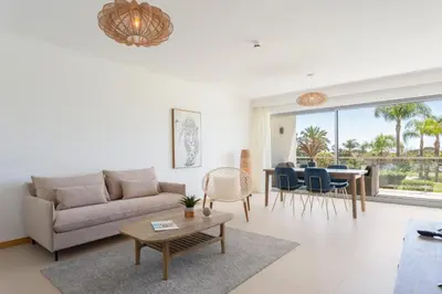 a living room with a couch and a table at Snazzy Varandas do Castelo - One Bedroom Apartment sleeps 2 person in Albufeira
