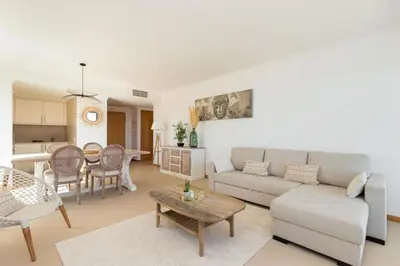 a living room with a couch and a table at Snazzy Varandas do Castelo One-Bedroom Apartment sleeps 2 person in Albufeira