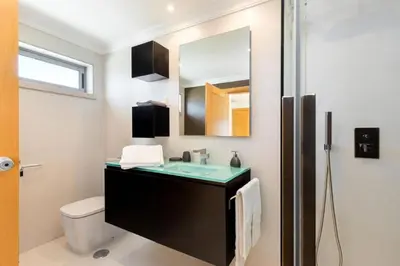 a bathroom with a sink and a mirror at Snazzy Varandas do Castelo One-Bedroom Apartment sleeps 2 person in Albufeira