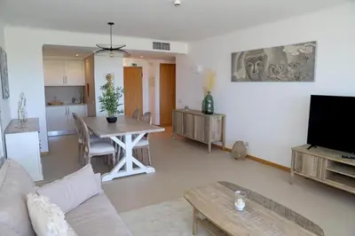 a living room with a couch and a table at Snazzy Varandas do Castelo One-Bedroom Apartment sleeps 2 person in Albufeira