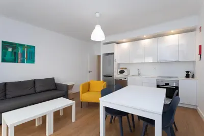 a living room with a couch and a table at AL - Apartamentos Vista Mar in Quarteira